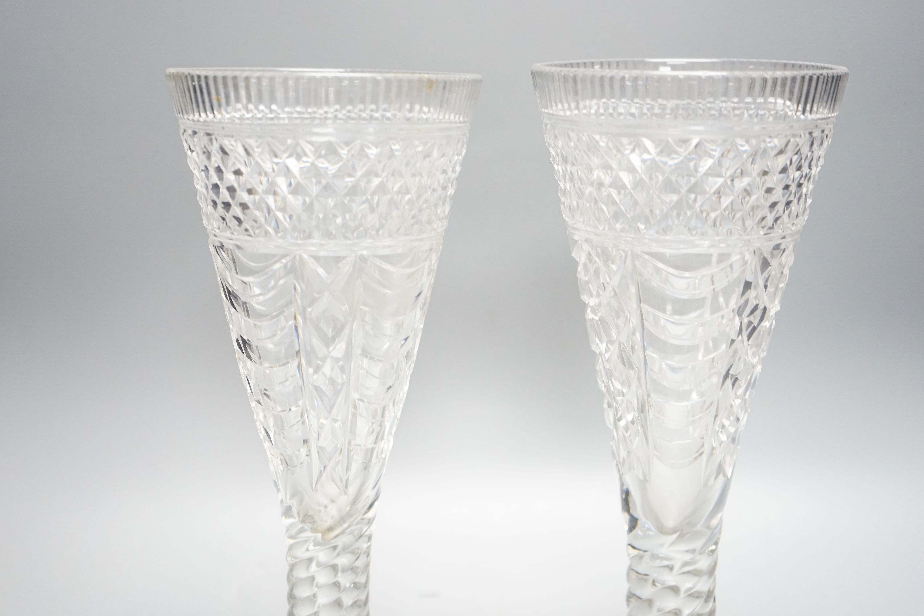 A pair of 19th century large glass goblets or vases, each on spiral-twist stem and circular foot with pontil mark 30cm